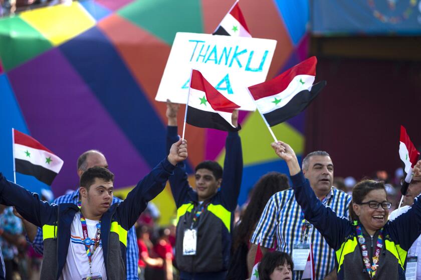 The Syrian Special Olympics team walks out for the Special Olympics World Games Closing Ceremony at the Los Angles Memorial Coliseum on Sunday.