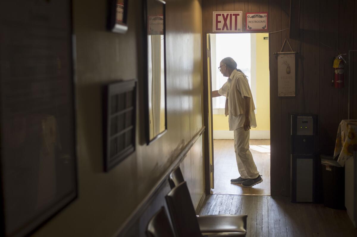 Participants close off a room for the healing service at the Cassadaga Spiritualist Camp.