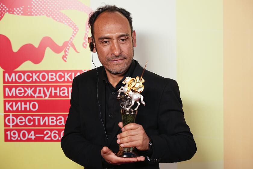 Mexican director Miguel Salgado poses with his the Golden Saint George trophy for a photo after the closing ceremony of the 46th Moscow International Film Festival in Moscow, Russia, on Friday, April 26, 2024. A Mexican film has won the top prize at the Moscow International Film Festival which took place as major Western studios boycott the Russian market and as Russia's war in Ukraine grinds into its third year. "Shame," a film by director Miguel Salgado and co-produced by Mexico and Qatar, was the most highly awarded film at the festival which began in 1935 and which has been held annually since 1999. (AP Photo/Alexander Zemlianichenko)