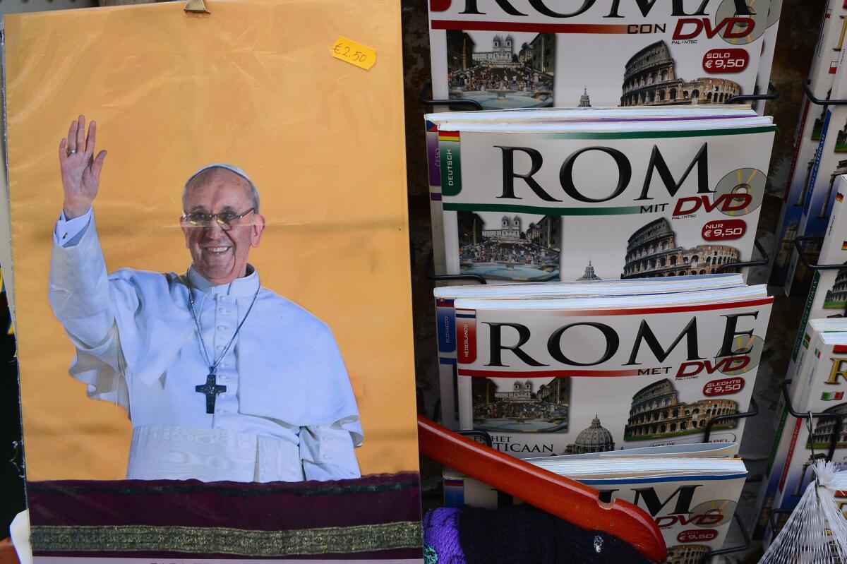 Guidebooks for sale at a souvenir shop in Rome.