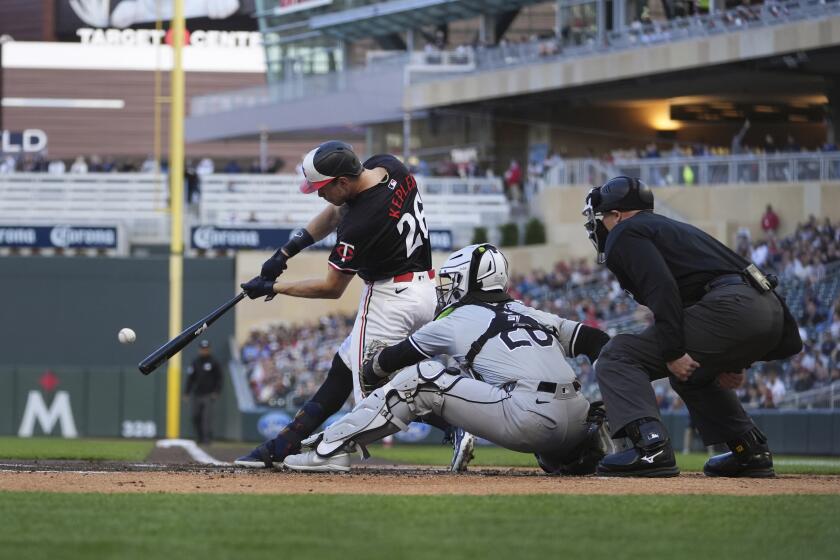 Minnesota Twins' Max Kepler (26) hits an RBI-double during the first inning of a baseball game against the Chicago White Sox, Monday, April 22, 2024, in Minneapolis. (AP Photo/Abbie Parr)