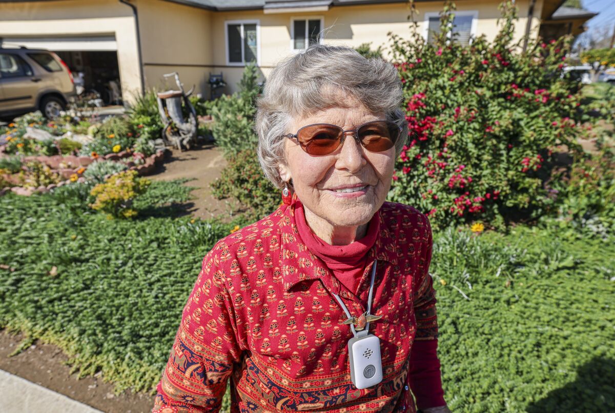 Jeanne Reutlinger, who is the WaterSmart garden winner, stands in front of her Escondido home.