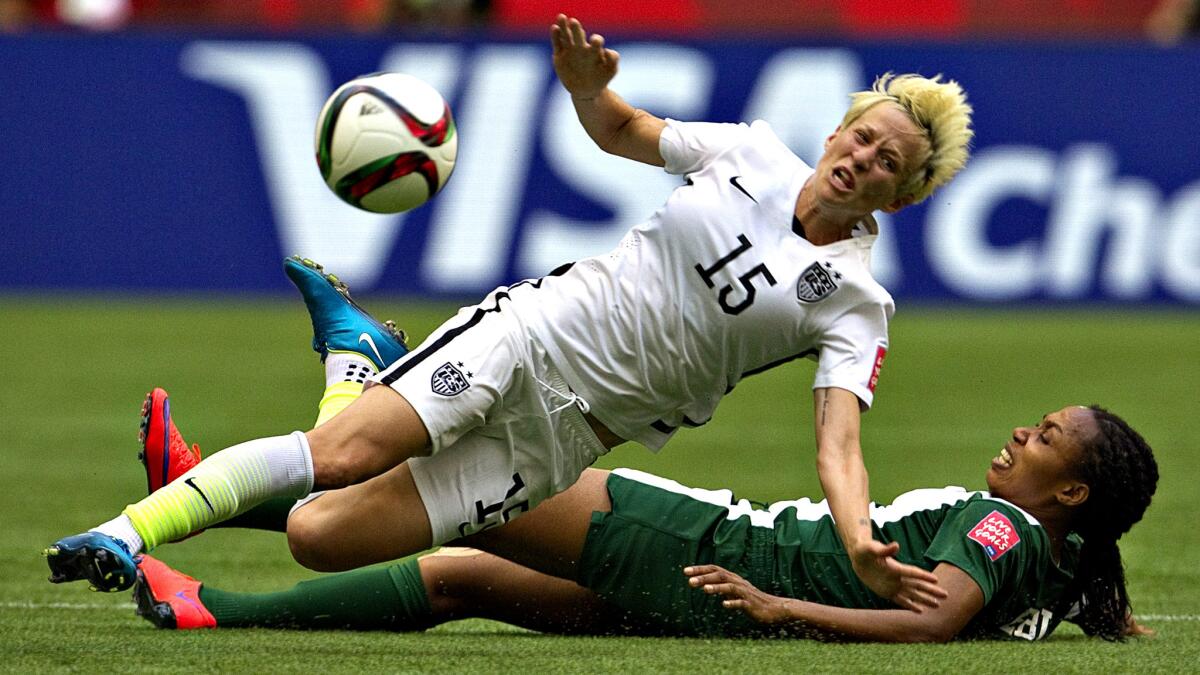 U.S. midfielder Megan Rapinoe, here being brought down by a tackle at last year's World Cup, will play in the Olympics after overcoming a major knee injury.