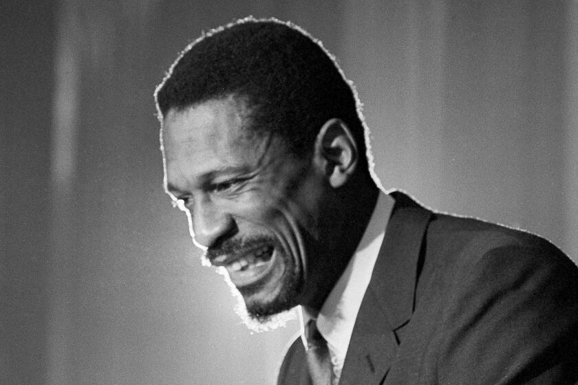 FILE - Bill Russell grins at announcement that he had been named coach of the Boston Celtics.