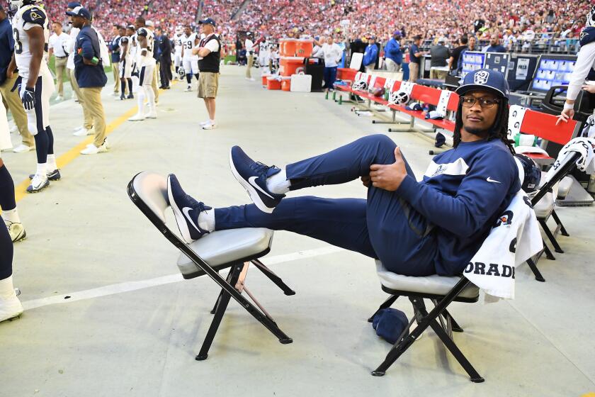 Rams running back Todd Gurley sits on sideline during a December 2018 road game vs. Arizona.