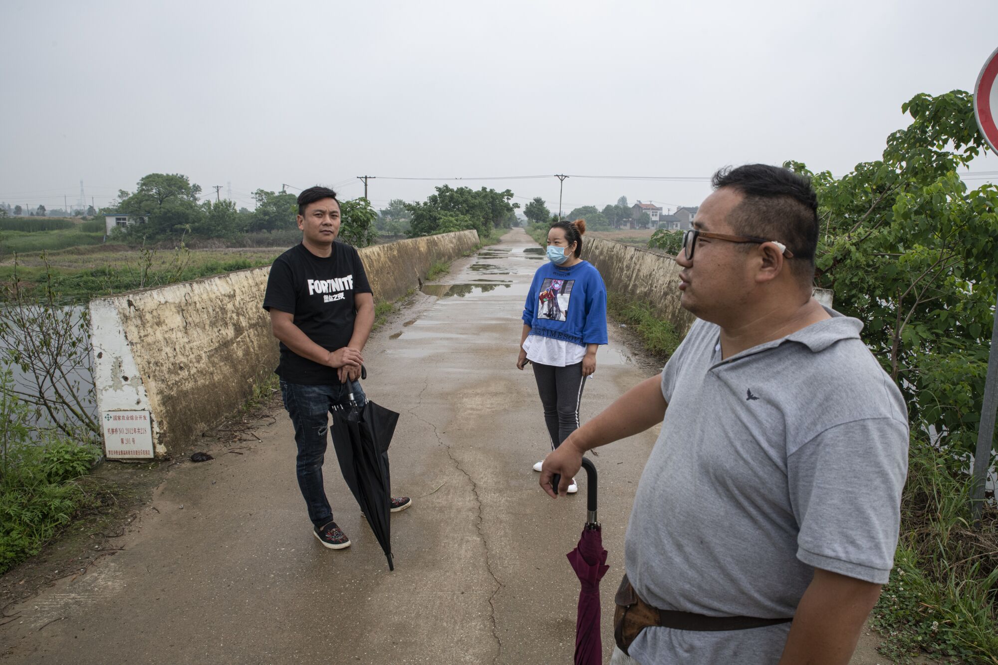 Chen Wenxi, left, and Pan Bangfeng, right, best friends and migrant workers, in their home village.