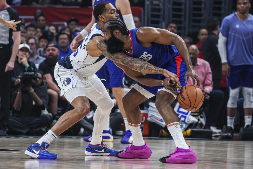 Los Angeles, CA, Sunday, April 21, 2024 - Dallas Mavericks forward P.J. Washington (25) pokes the ball from LA Clippers guard James Harden (1) during first half action in game one of the NBA Western Conference playoffs at Crypto.Com Arena. (Robert Gauthier/Los Angeles Times)