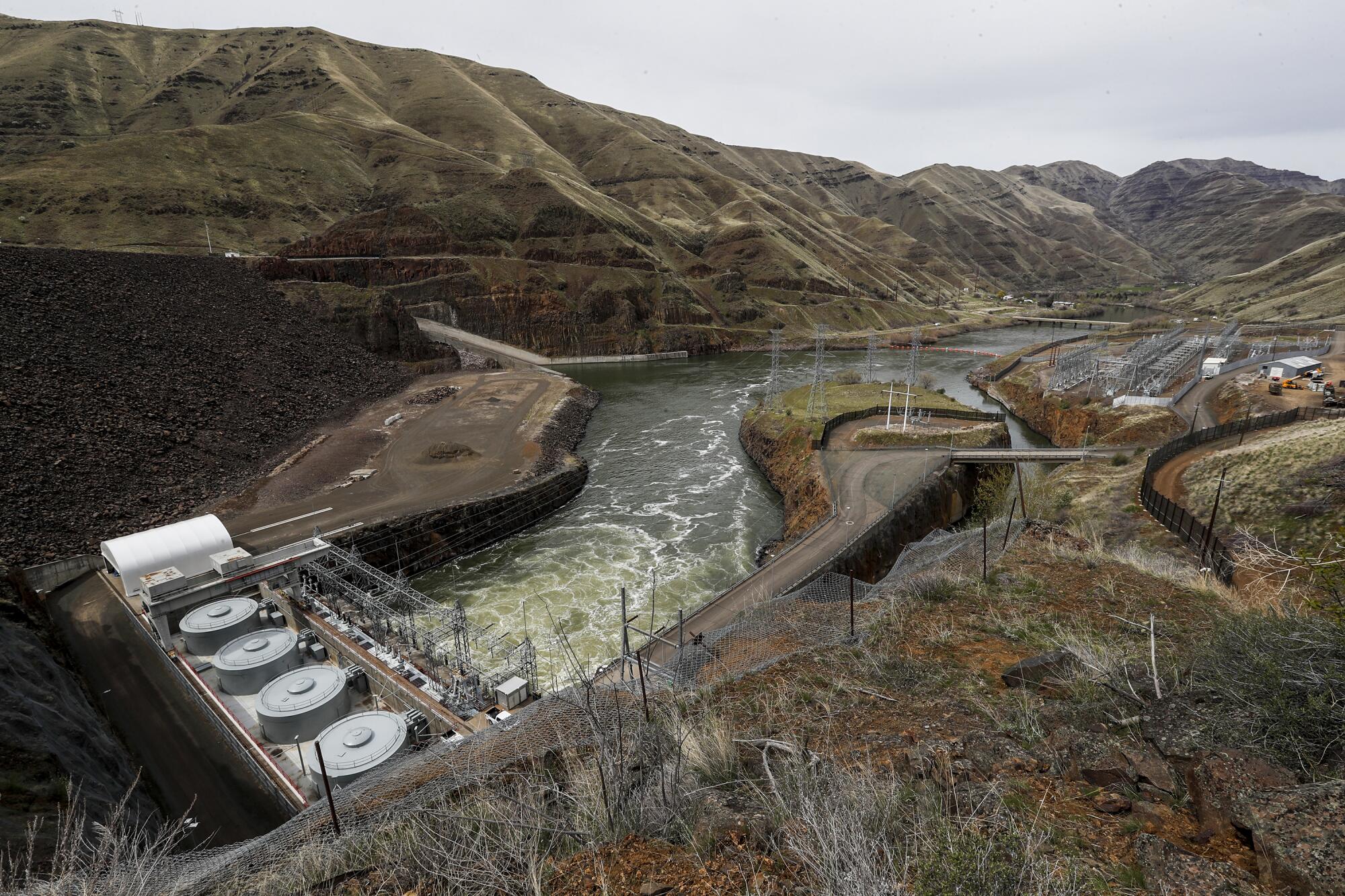 The Snake River flows through hydropower turbines at Brownlee Dam.