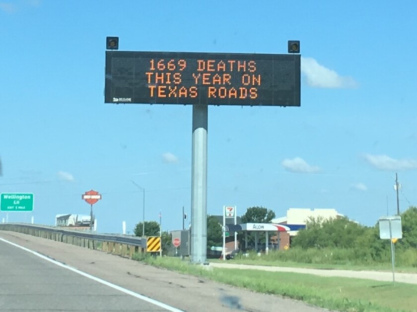 A message board along a Texas highway displays the number of deaths from crashes so far that year.