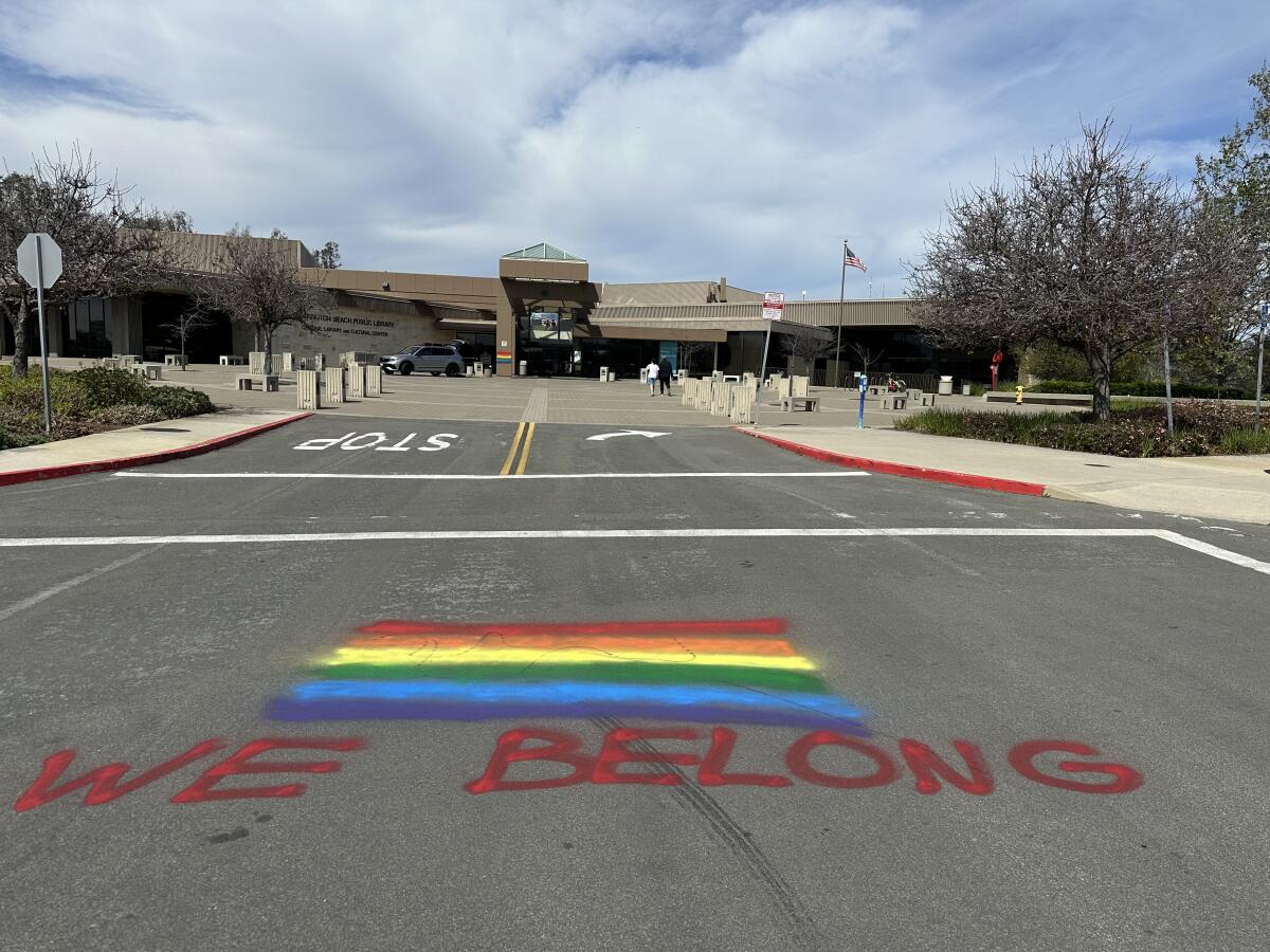 Graffiti left in the parking lot of the Huntington Beach Central Library was discovered Sunday.