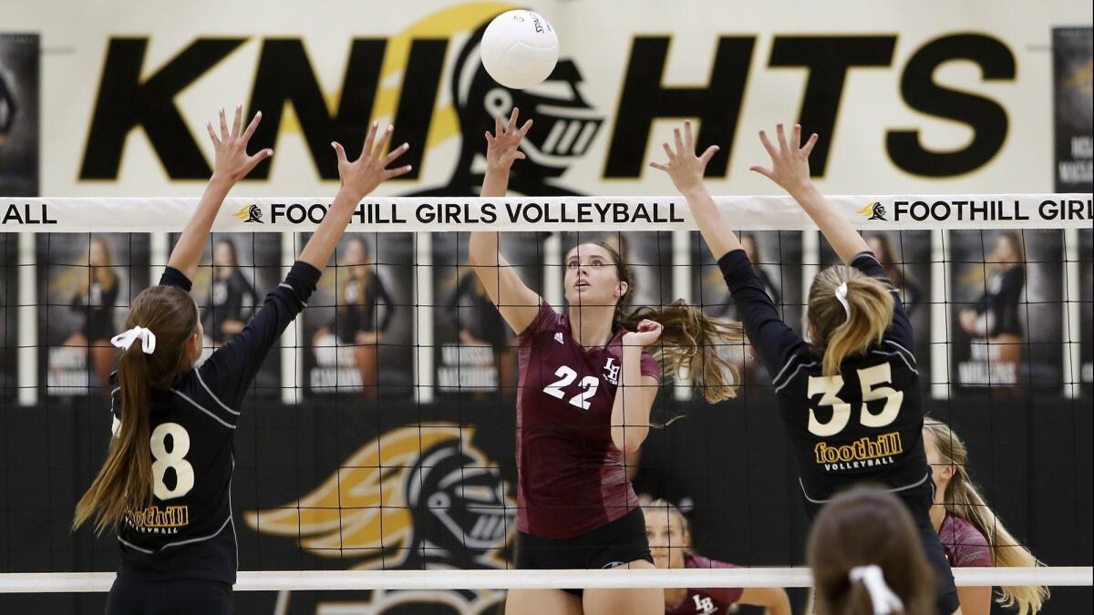 Kendall Fraser (22) scores for Laguna Beach High in the first set of a nonleague match at Foothill on Wednesday.