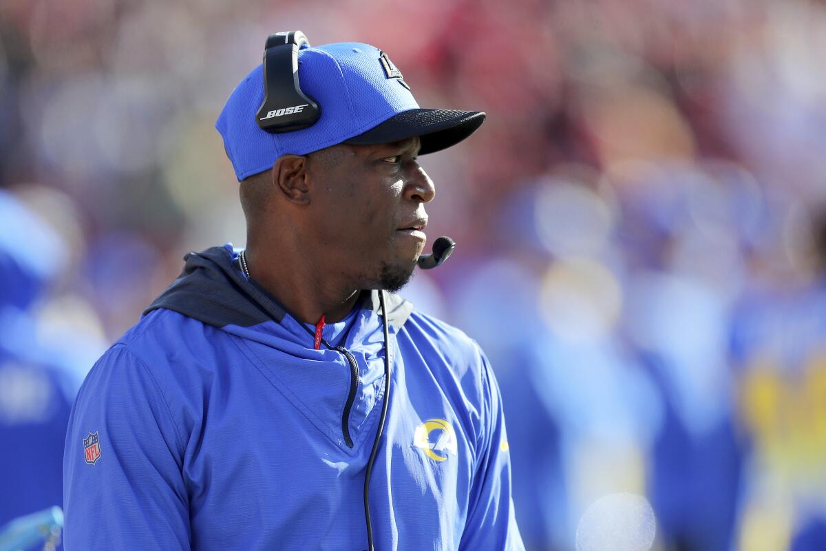 Rams defensive coordinator Raheem Morris watches from the sideline during a game.