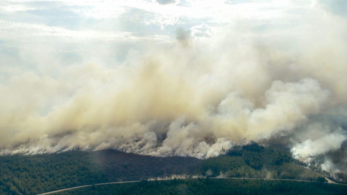 An aerial photo shows the advancing fire around Ljusdal, Finland, as the blaze sweeps through the large forest area on July 18, 2018. Dry weather has endangered large tracts of forest and many residential areas.
