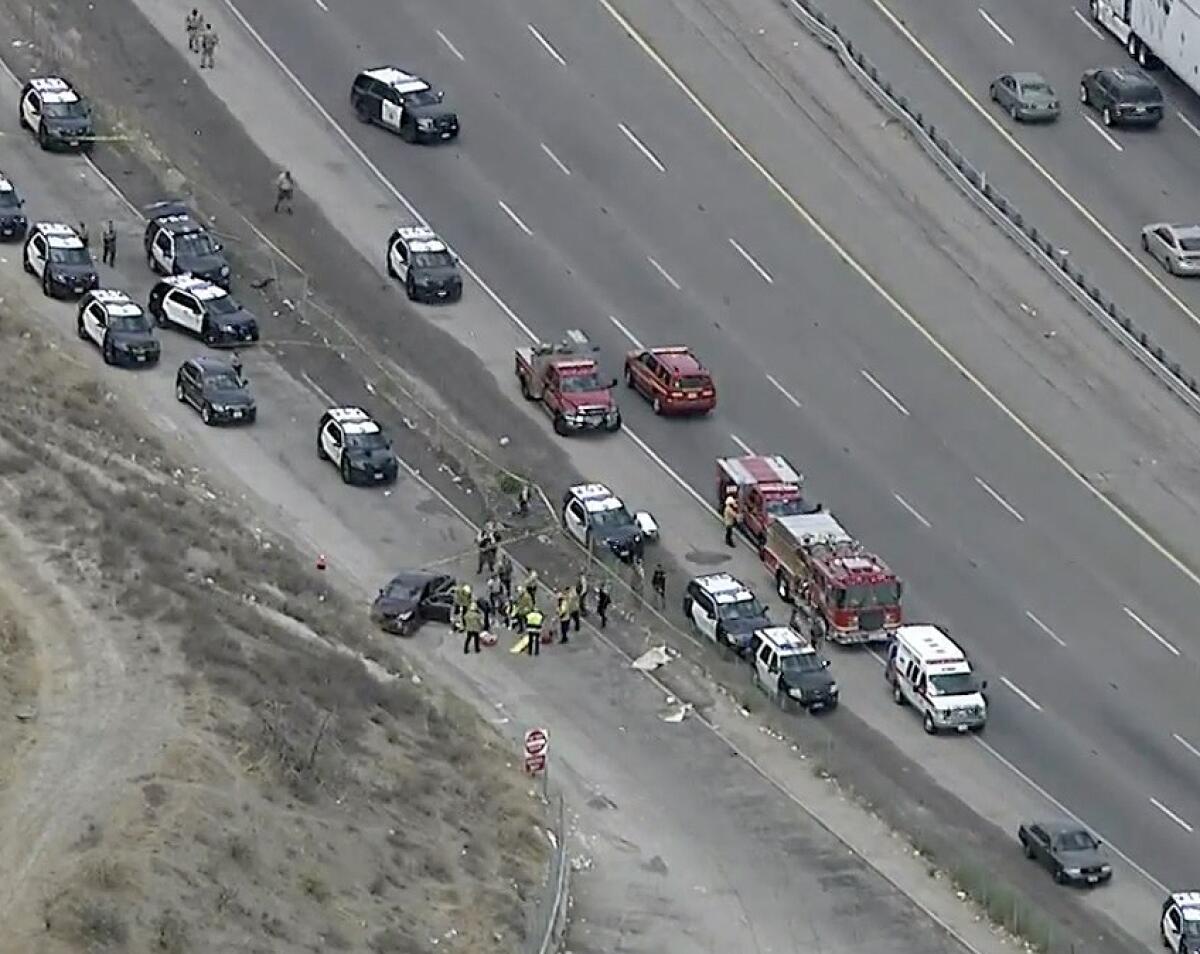 First responders attend to the scene of an accident.