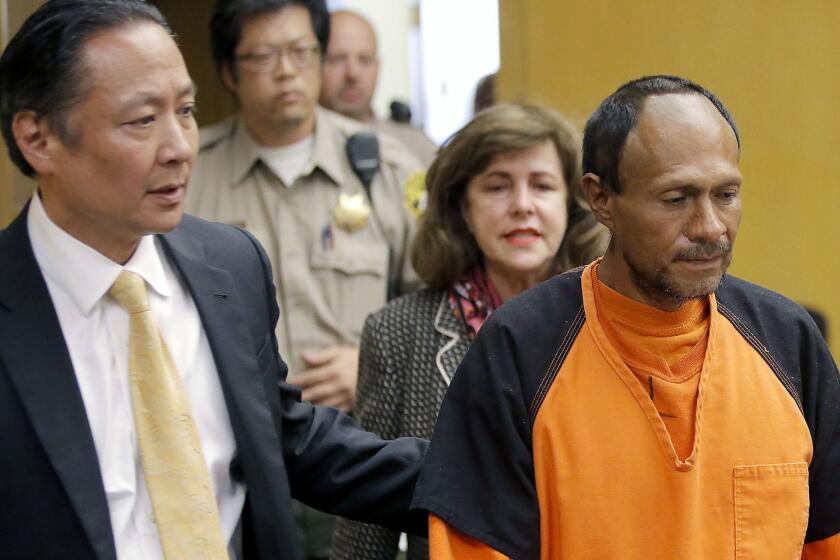FILE - In this July 7, 2015 file photo, Jose Ines Garcia Zarate, right, is led into the courtroom by San Francisco Public Defender Jeff Adachi, left, and Assistant District Attorney Diana Garciaor, center, for his arraignment at the Hall of Justice in San Francisco. Garcia Zarate, a homeless undocumented immigrant acquitted of killing Kate Steinle on a San Francisco pier ,is scheduled to be sentenced on a lesser gun charge Friday, Jan. 5, 2018. (Michael Macor/San Francisco Chronicle via AP, Pool, File)