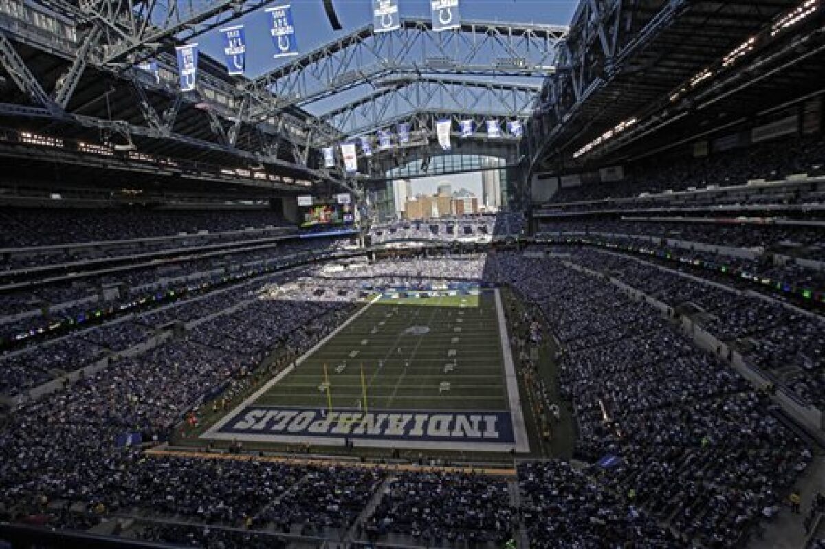 In this Sunday, Nov. 6, 2011 file photo, fans sit packed into Lucas Oil Stadium during the first half of an NFL football game between the Indianapolis Colts and the Atlanta Falcons in Indianapolis. (AP Photo/AJ Mast, File)