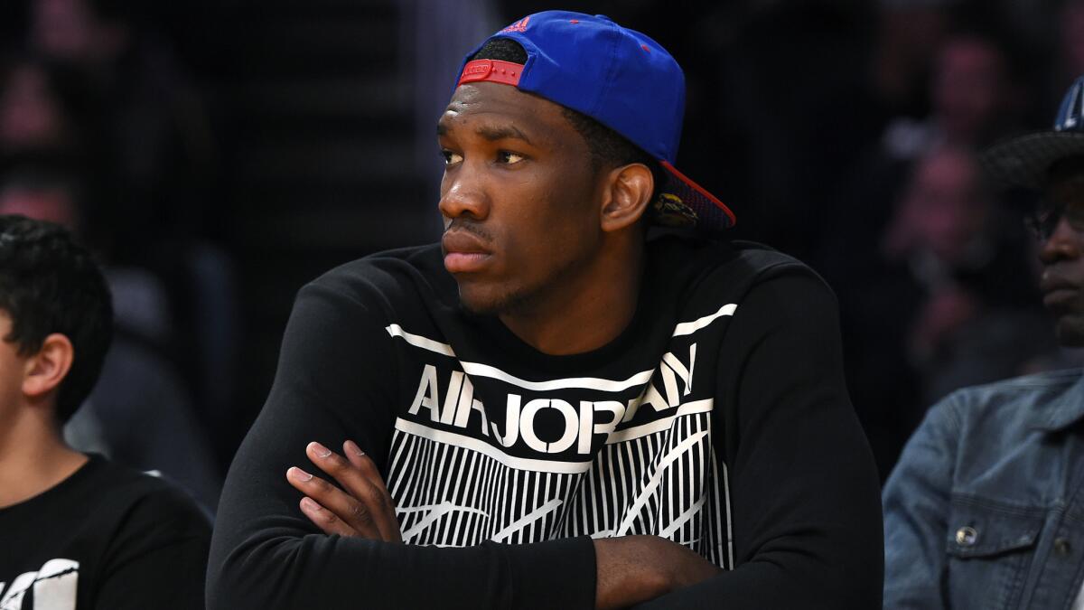 Kansas center Joel Embiid watches the Lakers play the Memphis Grizzlies in April. The Lakers likely will need a lot of luck on their side in the lottery draft if they want to use their draft pick on Embiid.