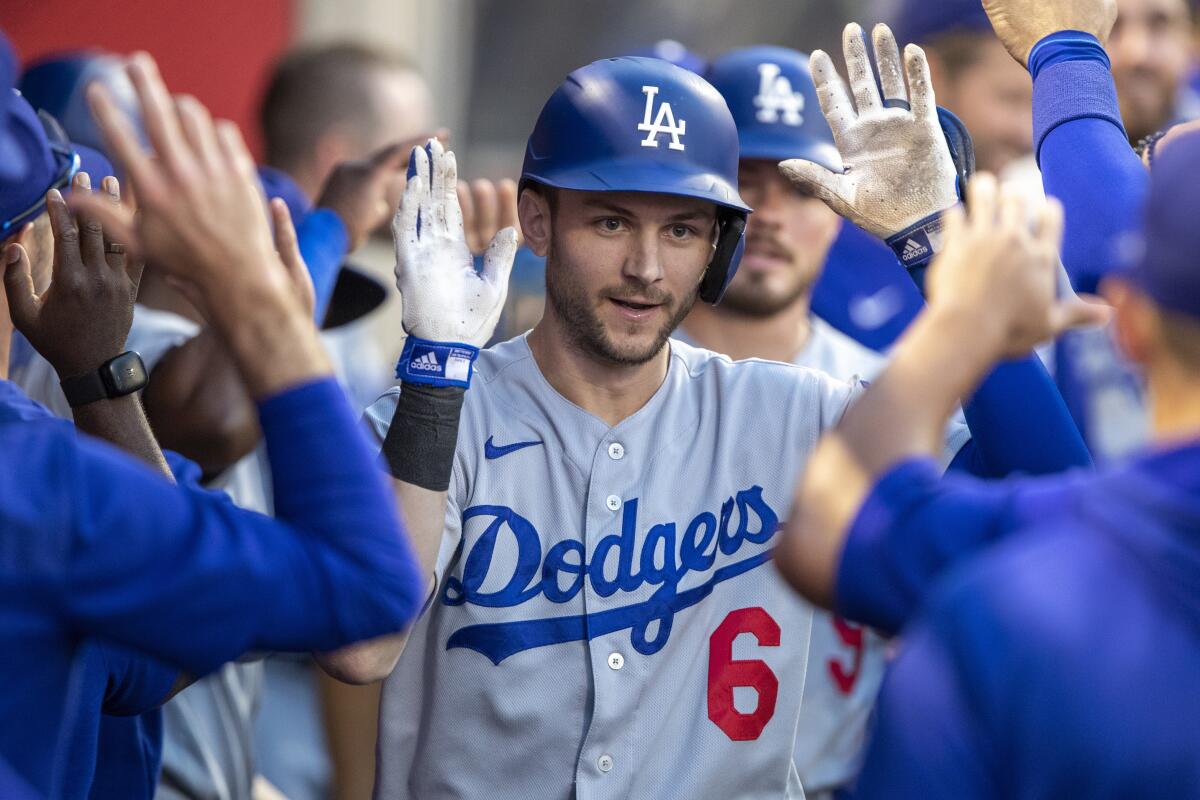Dodgers shortstop Trea Turner, center, celebrates with teammates after hitting a two-run home run against the Angels.