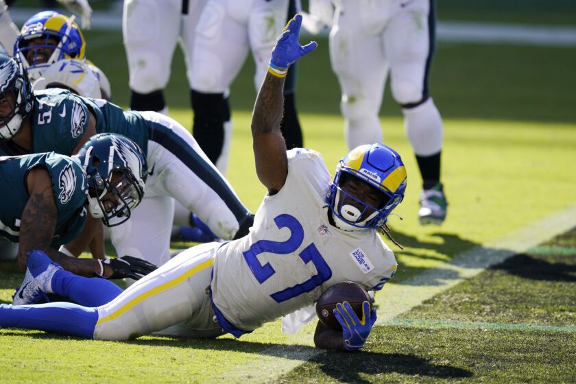 Los Angeles Rams' Darrell Henderson reacts after scoring a touchdown during the second half of an NFL football game against the Philadelphia Eagles, Sunday, Sept. 20, 2020, in Philadelphia. (AP Photo/Chris Szagola)