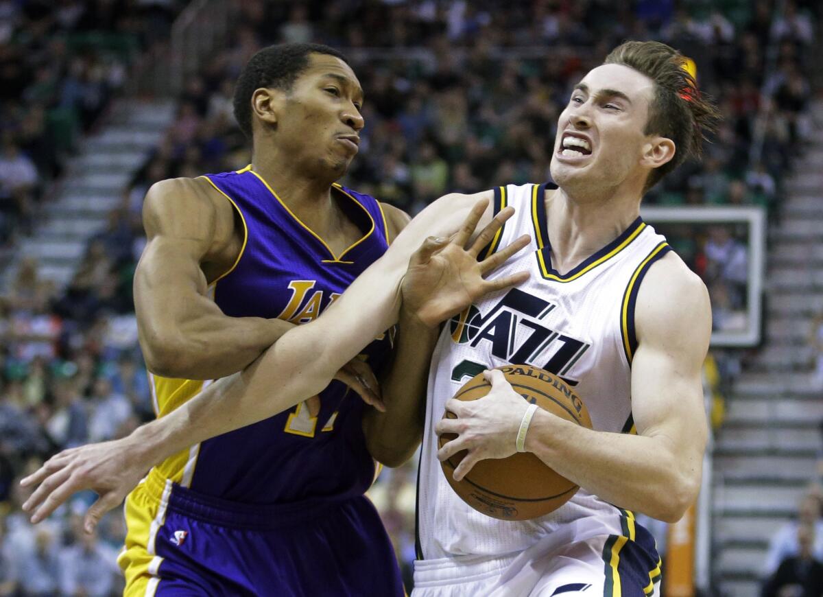Lakers forward Wesley Johnson tries to defend driving Jazz forward Gordon Hayward in the second half.