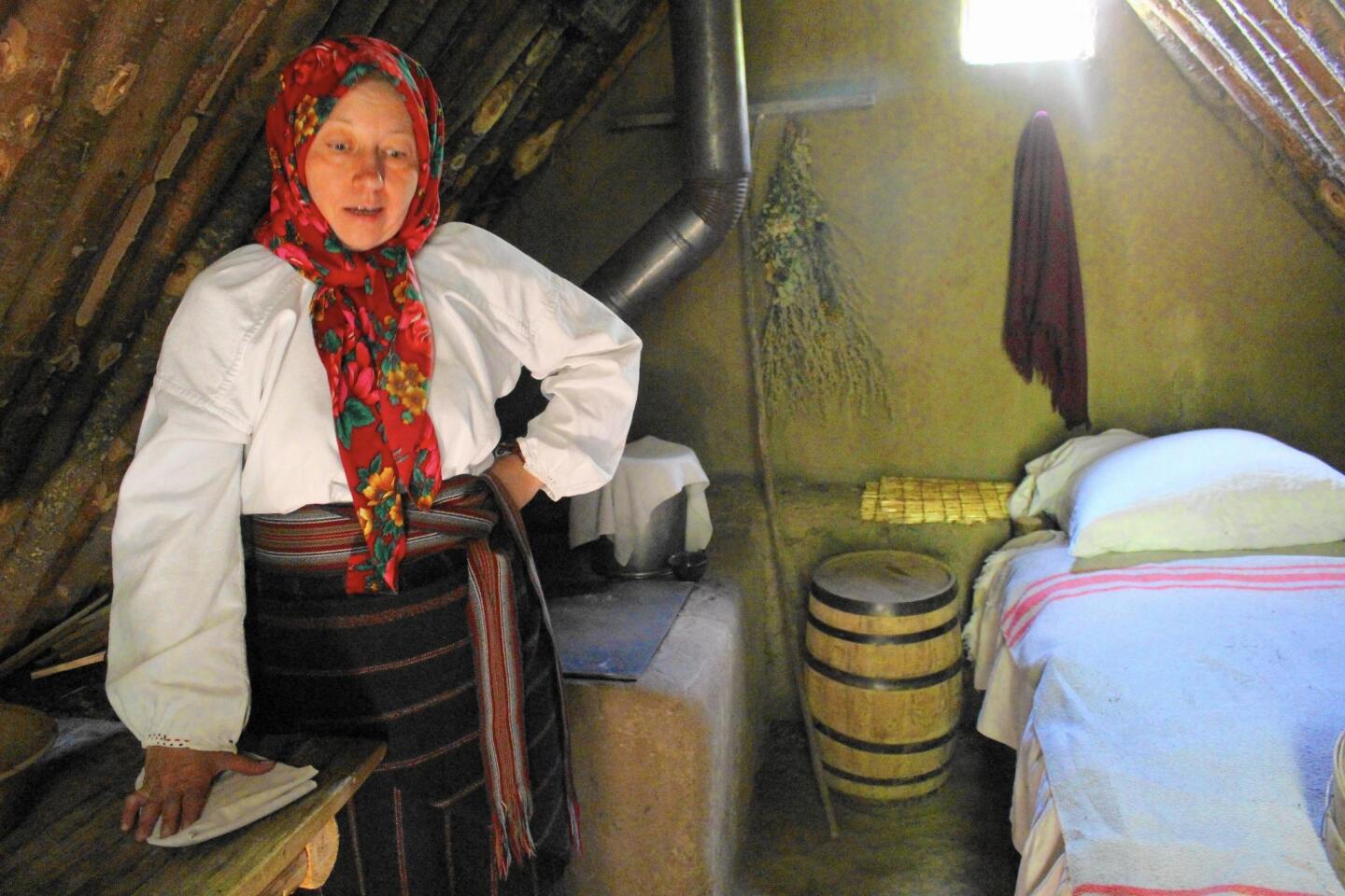 Maria, a Ukraine immigrant, explains life as a settler in pre-1900 Alberta from her dugout home at the Ukrainian Cultural Heritage Village, near Edmonton.