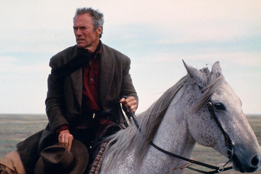 Clint Eastwood in horseback in the movie "Unforgiven" 