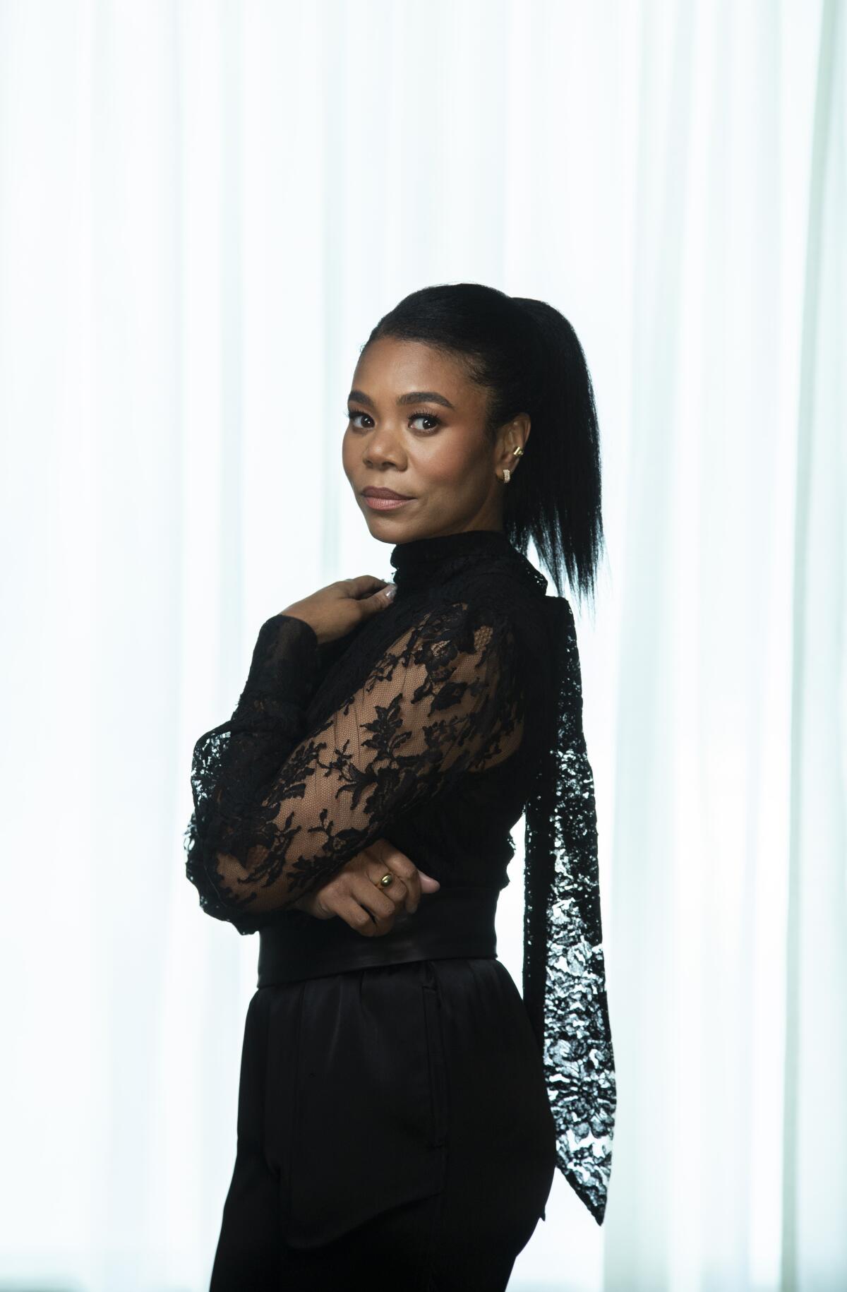 Regina Hall poses for a portrait in a lacy black outfit