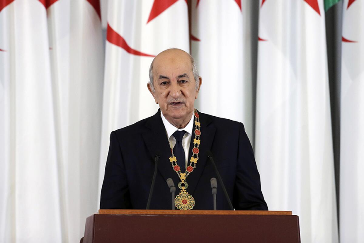 Algerian President Abdelmadjid Tebboune, 75, speaks from behind a lectern in December 2019.