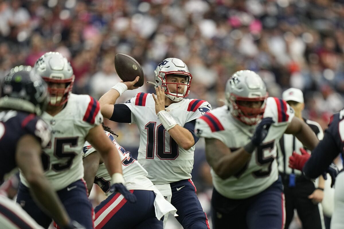 New England Patriots quarterback Mac Jones passes against the Houston Texans.