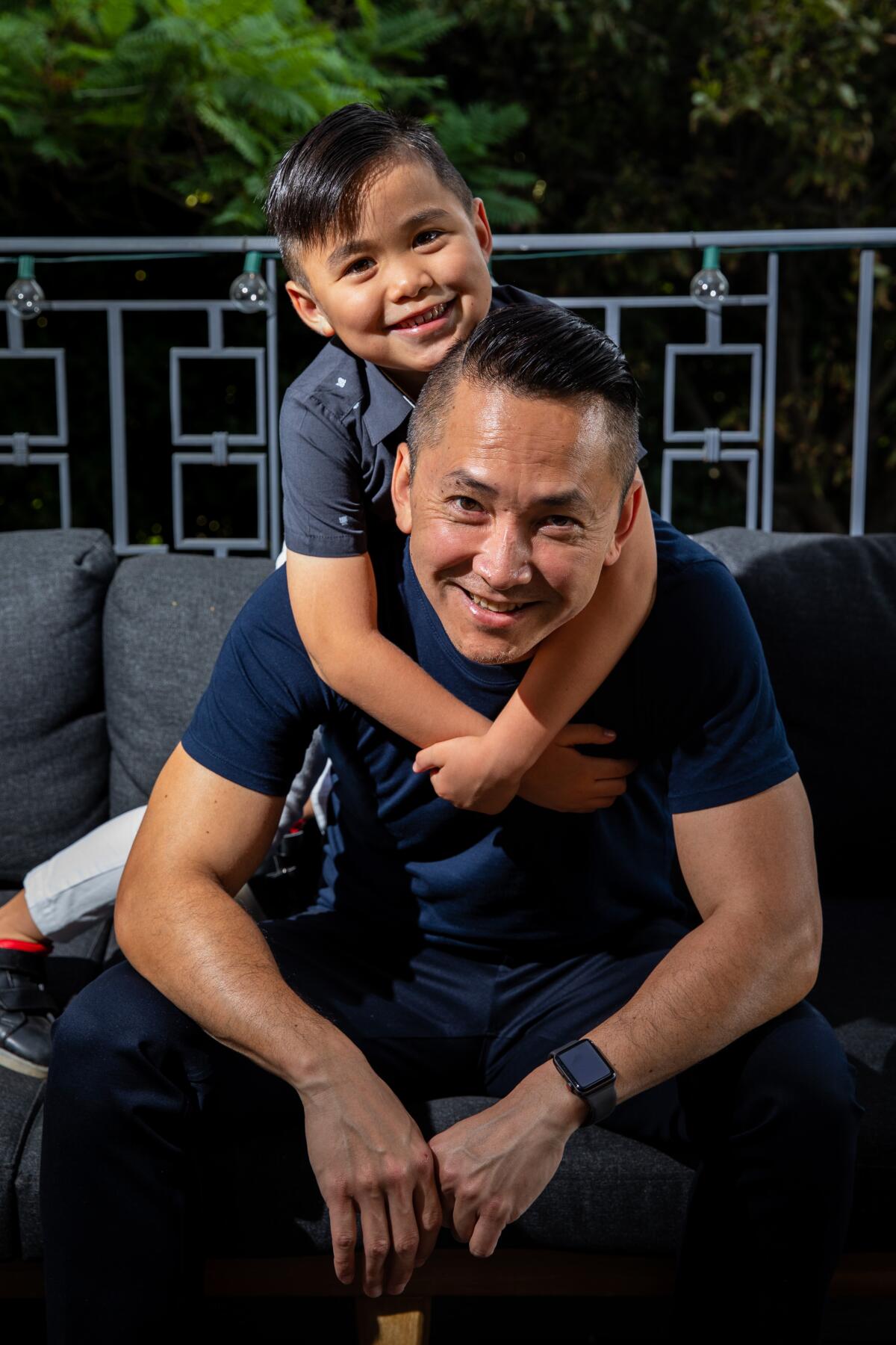 Viet Thanh Nguyen and his son, Ellison, at home.