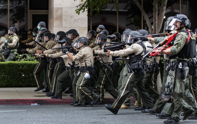 National Guard deploys to L.A. as looting, violence worsens - Los ...