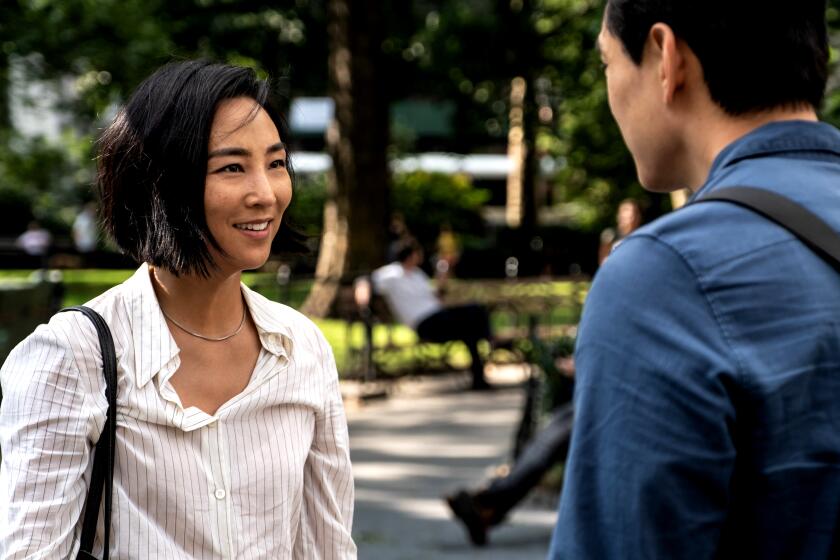 (L-R) Greta Lee, Teo Yoo in PAST LIVES.