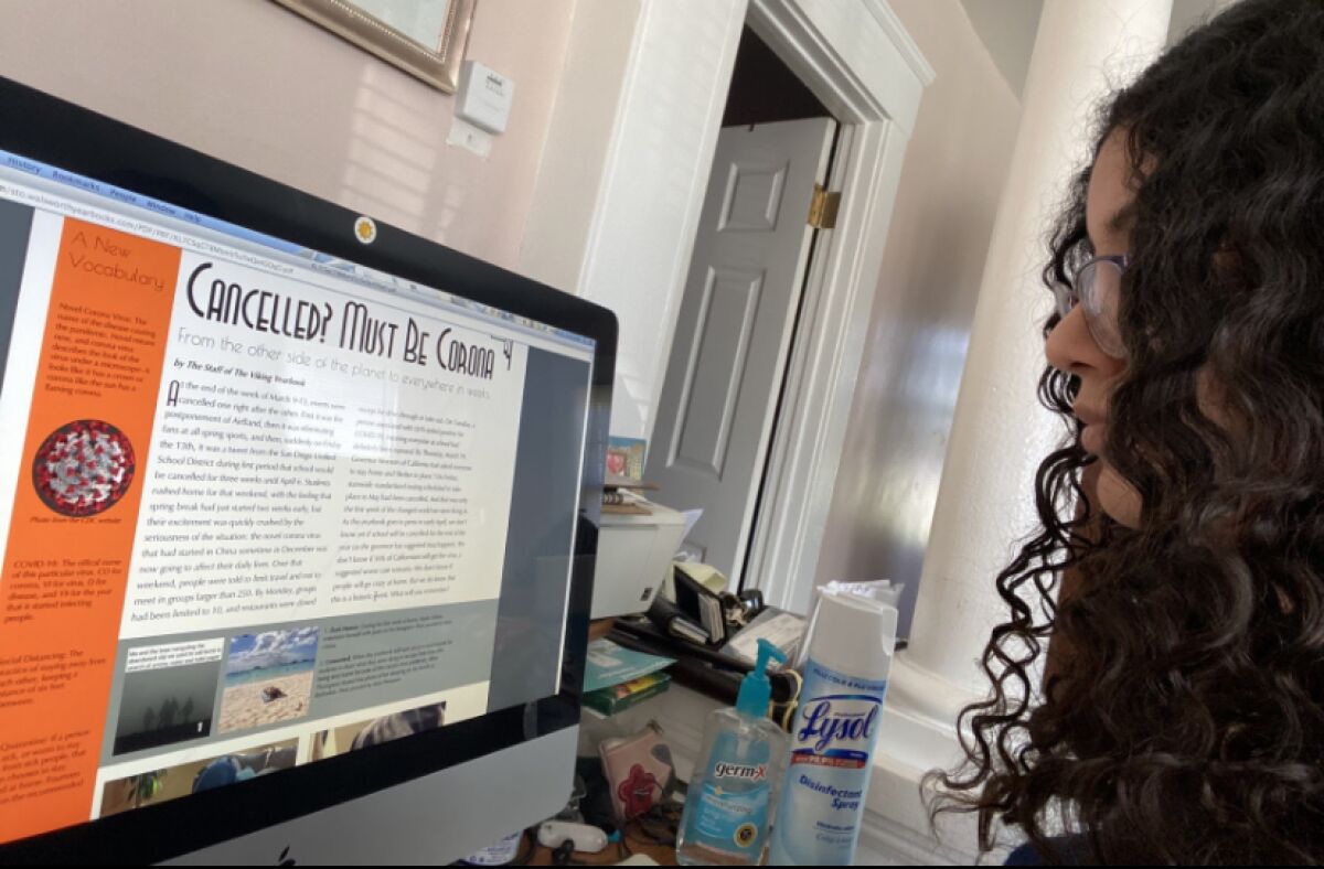 La Jolla High School senior Jennifer Aguilar helped edit the school yearbook at home, communicating with her teacher via email.