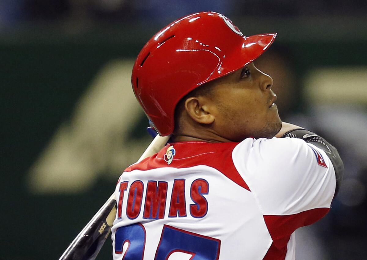 Cuba's Yasmany Tomas hits a three-run home run against Taiwan in a World Baseball Classic game last year.