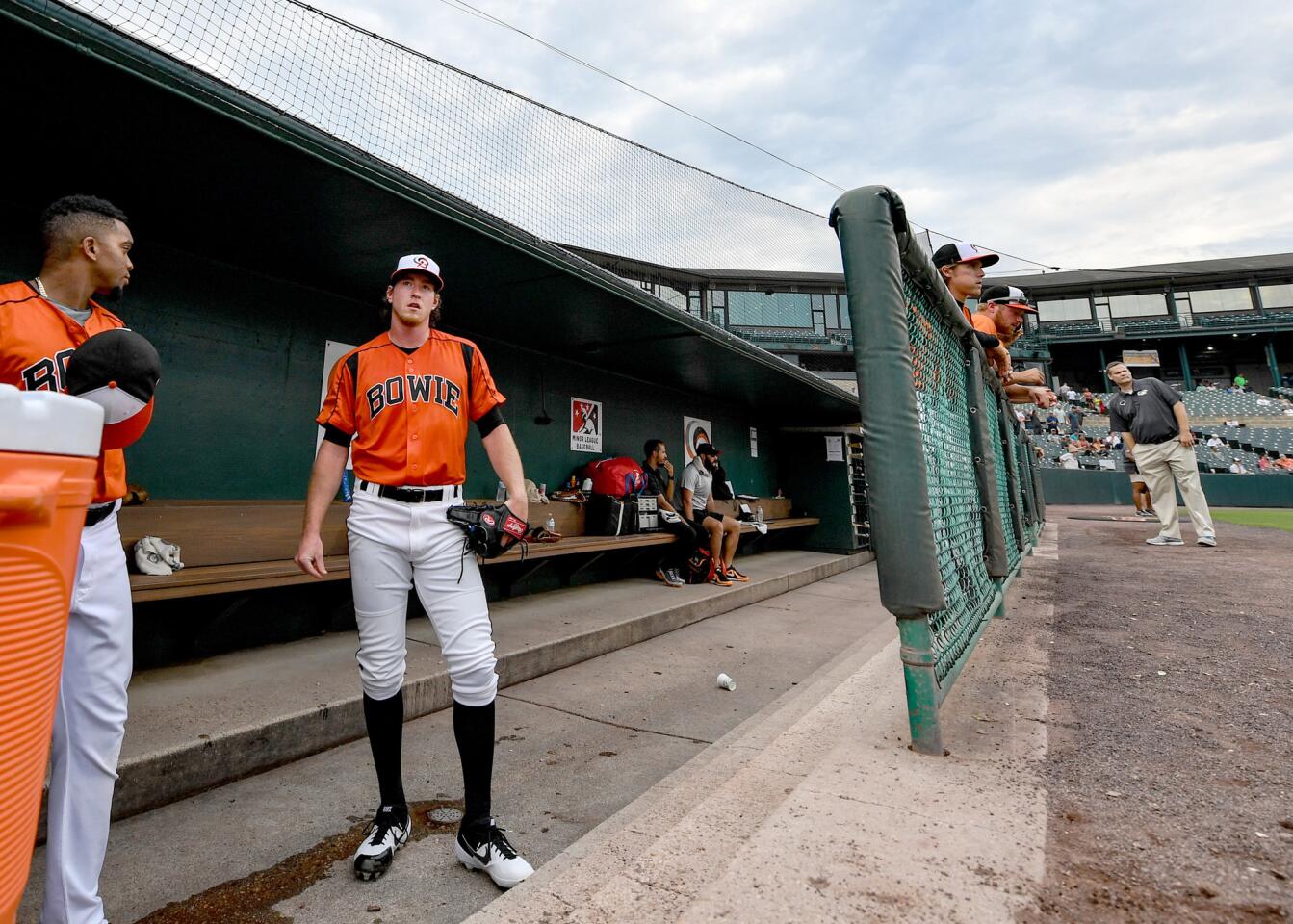 Michael Baumann, stands in the dugout during player instructions prior to the start of the game against Harrisburg. Orioles pitching prospect Michael Baumann took his dominance since joining Double-A Bowie to a new level Tuesday night with the third no-hitter in Baysox history. He mowed down Harrisburg on 95 pitches to solidify what’s been one of the most significant leaps any pitcher in the farm system has made this season.