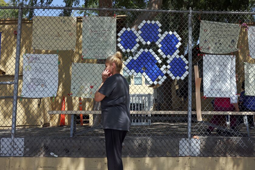 Los Angeles, CA - May 25: Parents wait for their children after school one day after 19 children and two adults were killed at a school shooting in Texas at Yorkdale Elementary School on Wednesday, May 25, 2022 in Los Angeles, CA. (Dania Maxwell / Los Angeles Times)
