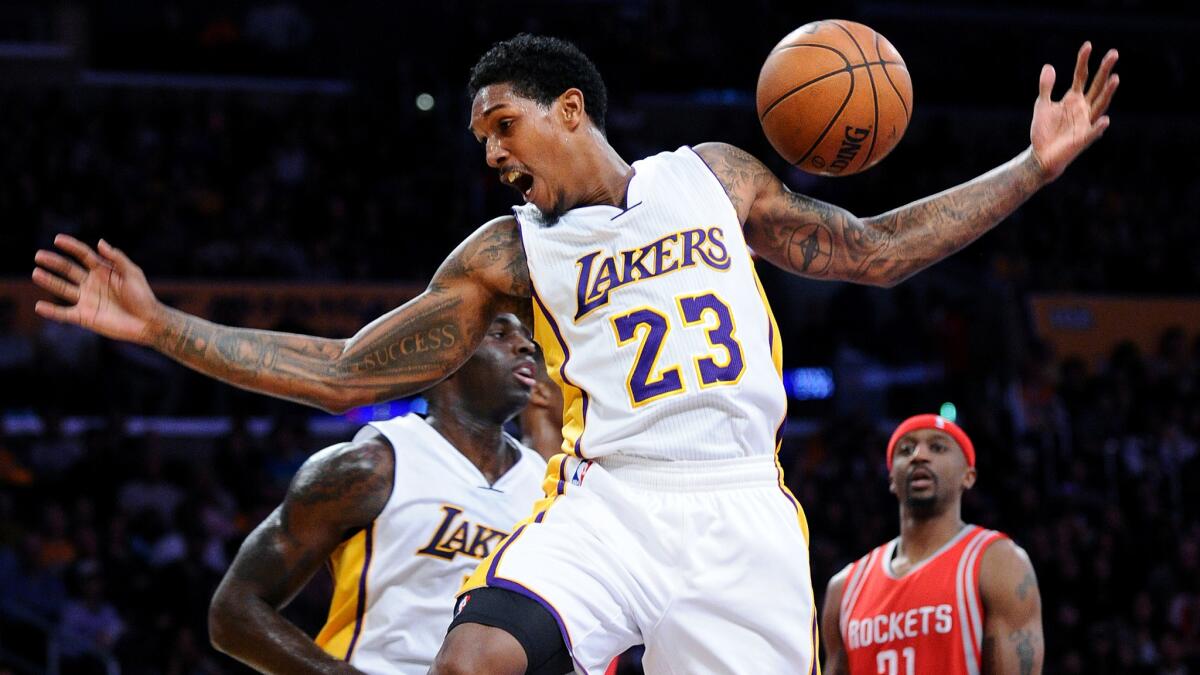 Lakers guard Lou Williams, seen after making a dunk last season, says, "I understand police have a hard job to do," but he's troubled by the use of "lethal force" over "childish crimes."