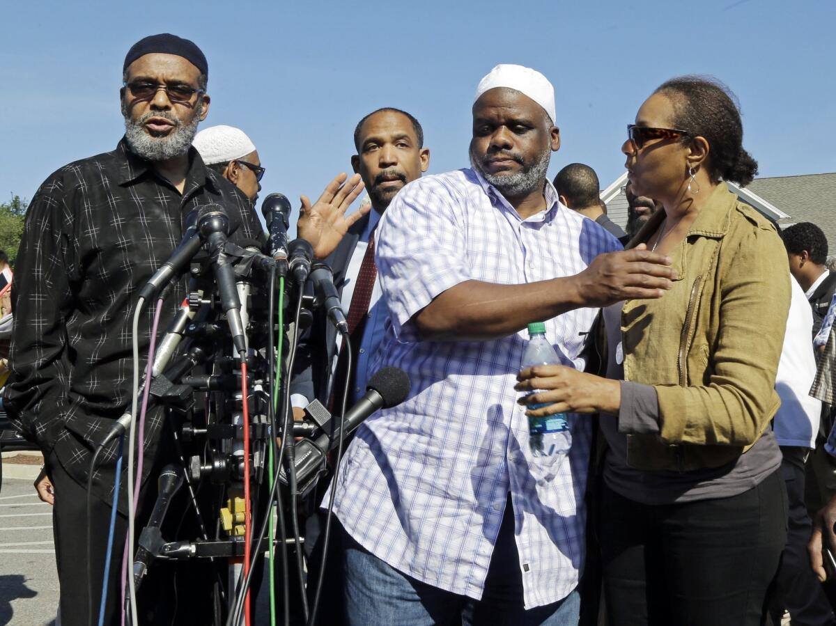 Ibrahim Rahim, second from right, brother of Usaamah Rahim, prepares to speak at a news conference Thursday.