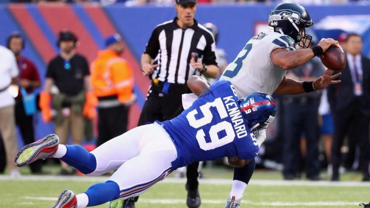Giants linebacker Devon Kennard (59) tackles Seahawks quarterback Russell Wilson on Oct. 22.