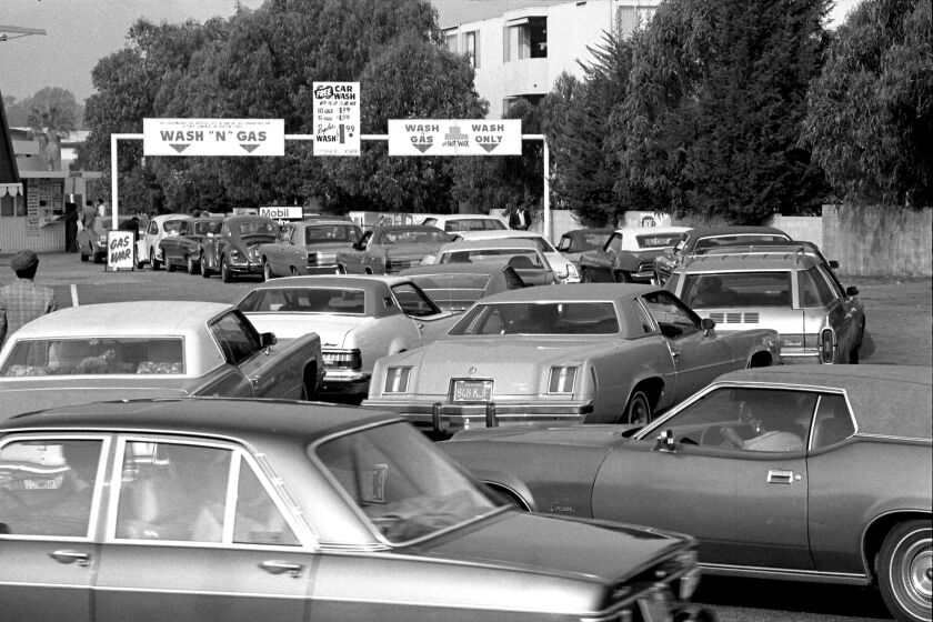 A crush of cars wait in line at a gas station and car wash in L.A.