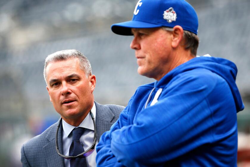 Dayton Moore, left, helped build the Kansas City Royals into a winner for Manager Ned Yost.