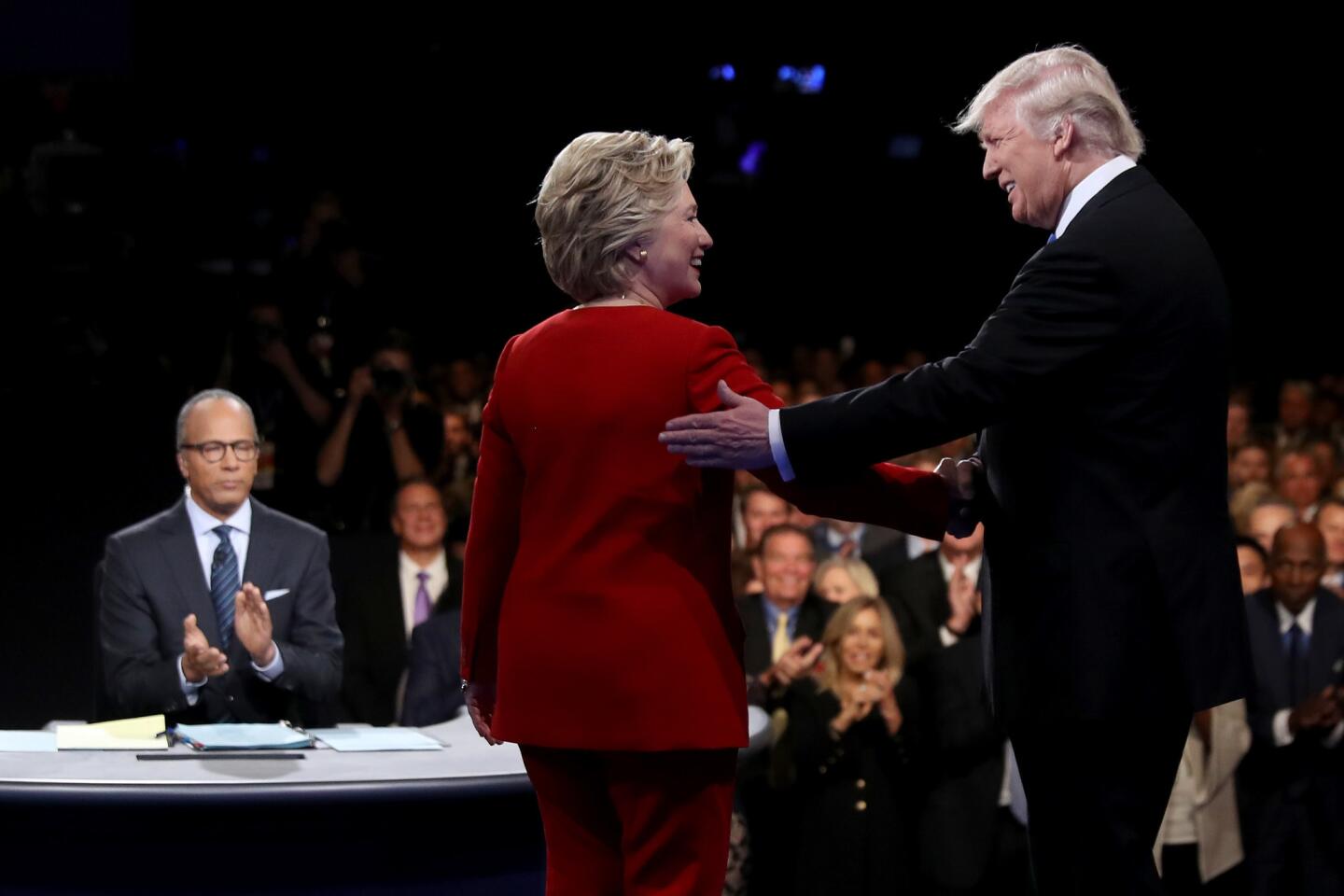 Hillary Clinton shakes hands with Donald Trump as moderator Lester Holt looks on during the presidential debate at Hofstra University on Sept. 26, 2016, in Hempstead, New York.