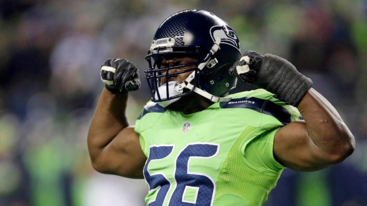 Seahawks defensive end Cliff Avril celebrates after sacking Rams quarterback Jared Goff during a game in Seattle on Dec. 15.