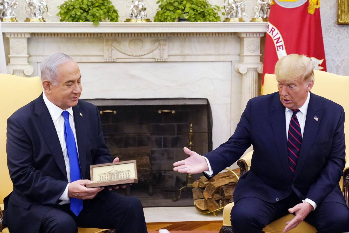 Benjamin Netanyahu and then-President Trump sit together in the Oval Office.