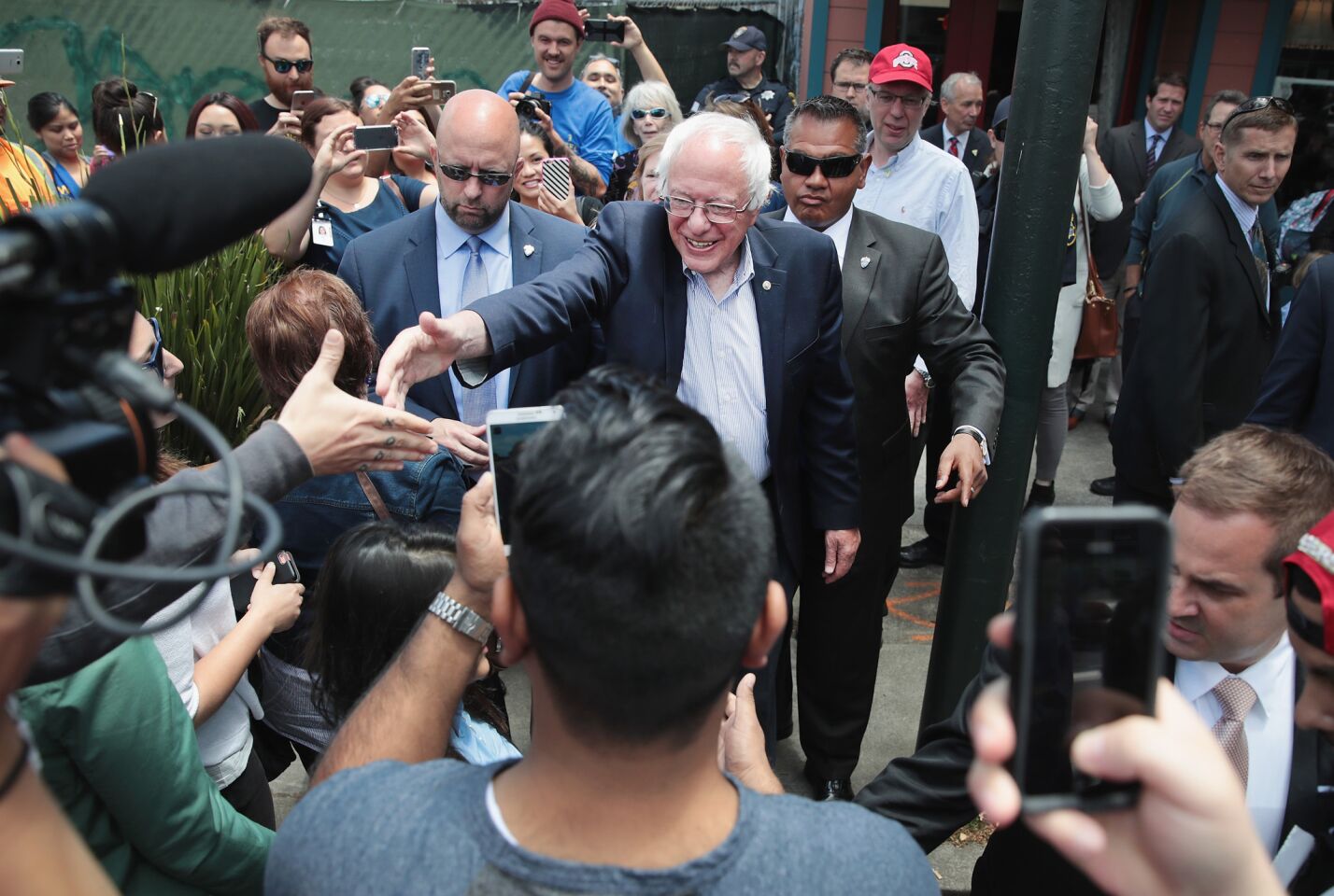 Bernie Sanders greets people in Oakland.
