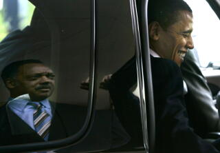 Democratic presidential hopeful Sen. Barack Obama, D-Ill., right, laughs after saying goodbye to Rev. Jesse Jackson.