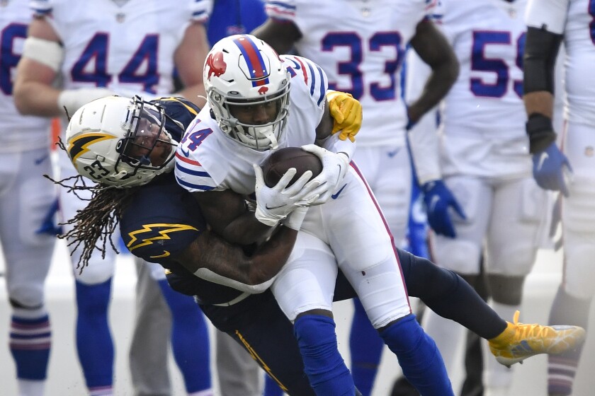 Buffalo Bills wide receiver Stefon Diggs is tackled by Chargers safety Rayshawn Jenkins.