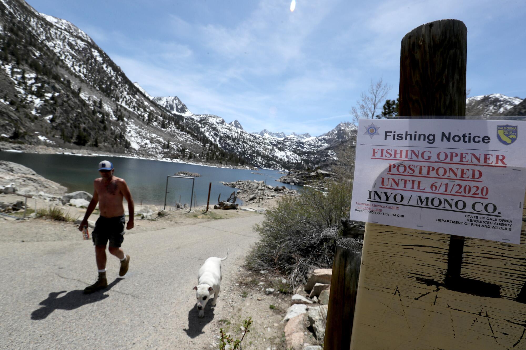 Signs at Lake Sabrina proclaim the postponement of fishing season on May 7 in Bishop.