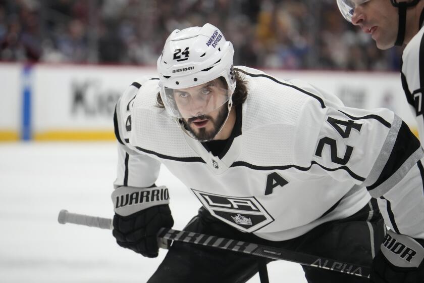 Los Angeles Kings center Phillip Danault (24) in the second period of an NHL hockey game Thursday, March 9, 2023, in Denver. (AP Photo/David Zalubowski)