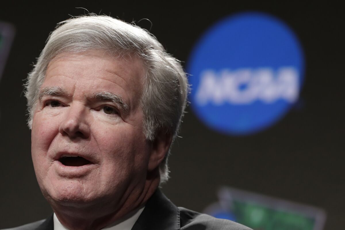 FILE - In this April 4, 2019, file photo, NCAA President Mark Emmert answers questions during a news conference at the Final Four college basketball tournament in Minneapolis. The NCAA is set to delay a potential landmark vote on legislation that would permit college athletes to be compensated for their fame for the first time after the association received a warning from the Department of Justice about potential antitrust violations. NCAA President Mark Emmert on Saturday, Jan. 9, 2020, emailed a letter to Makan Delrahim, assistant attorney general of the DOJ's antitrust division, saying he strongly recommended putting off votes on new name, image and likeness rules by two key legislative bodies that had been scheduled for next week. (AP Photo/Matt York, File)
